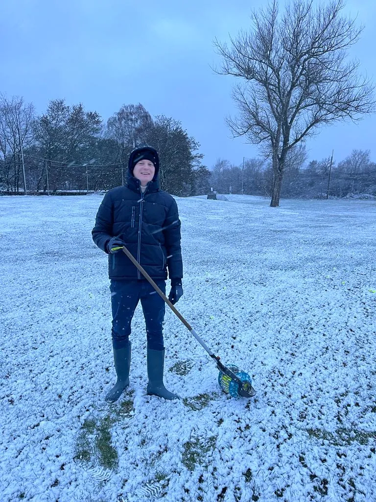 Team working in winter on the golf course